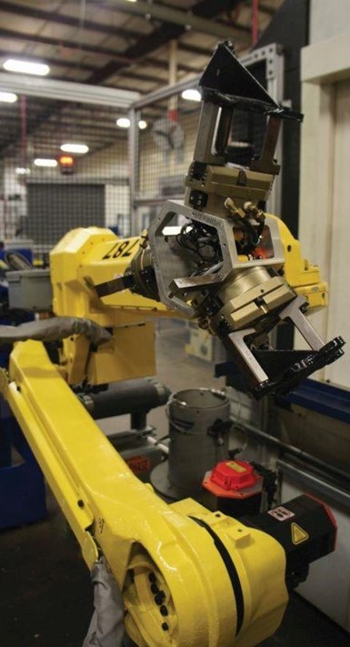 Robot con pinzas avanzadas sujetando partes en diferentes orientaciones.