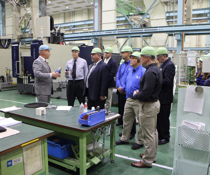 Robb Hudson, CEO, Mitsui Seiki (U.S.A.) Inc. and a group of visitors at Mitsui Seiki’s Japan machine tool factory