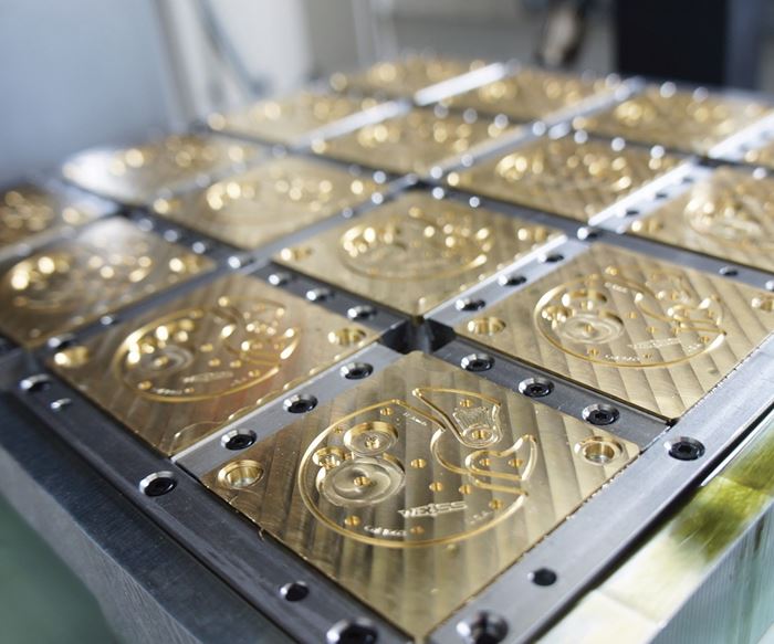 brass bridge workpieces after profile machining in a 16-station custom fixture