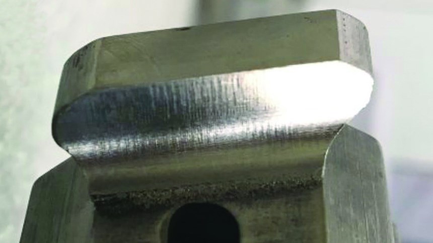 Turbine blade root form with 3D-printed feature after machining