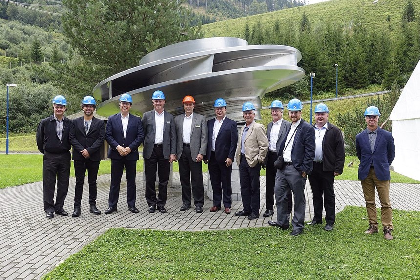 tour group in front of one the Dlouhé Stráně plant’s 325-W turbines