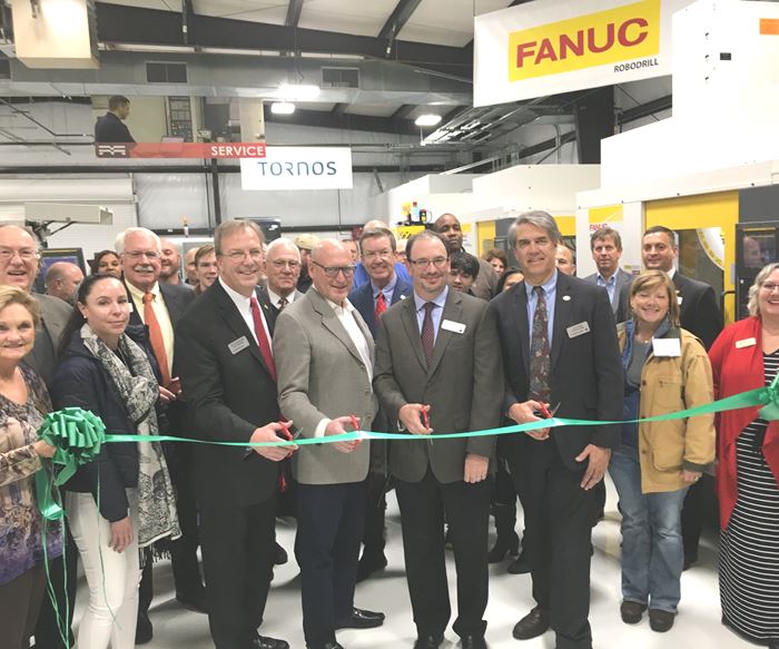 Methods Machine Tools representatives and others gather for a ribbon-cutting ceremony to open the company's new technical center in Memphis, TN.