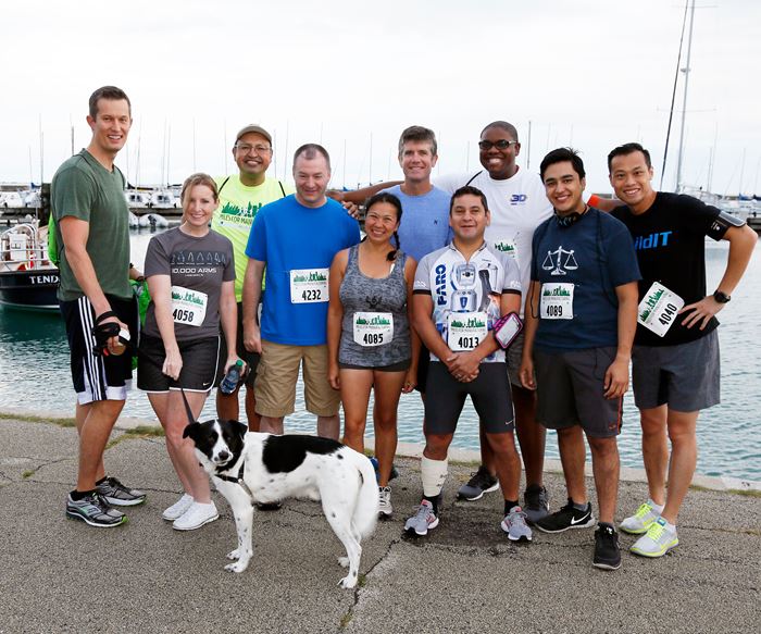 Runners posing before Miles for Manufacturing 5K