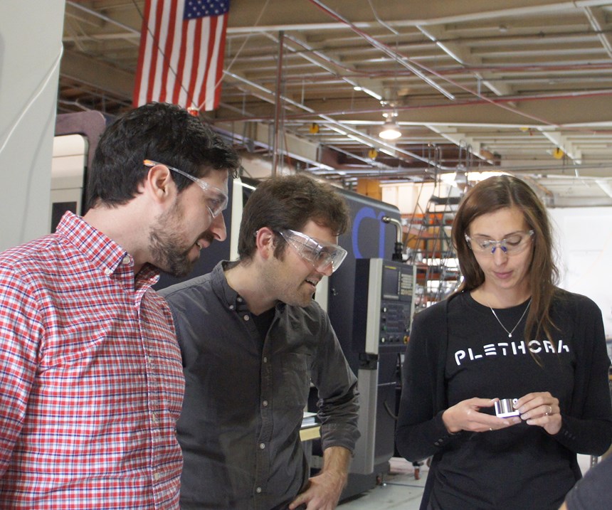Barbara Decker-Schoegl, production manager, discusses a recent custom machining job with Plethora founders Jeremy Herrman and Nick Pinkston  