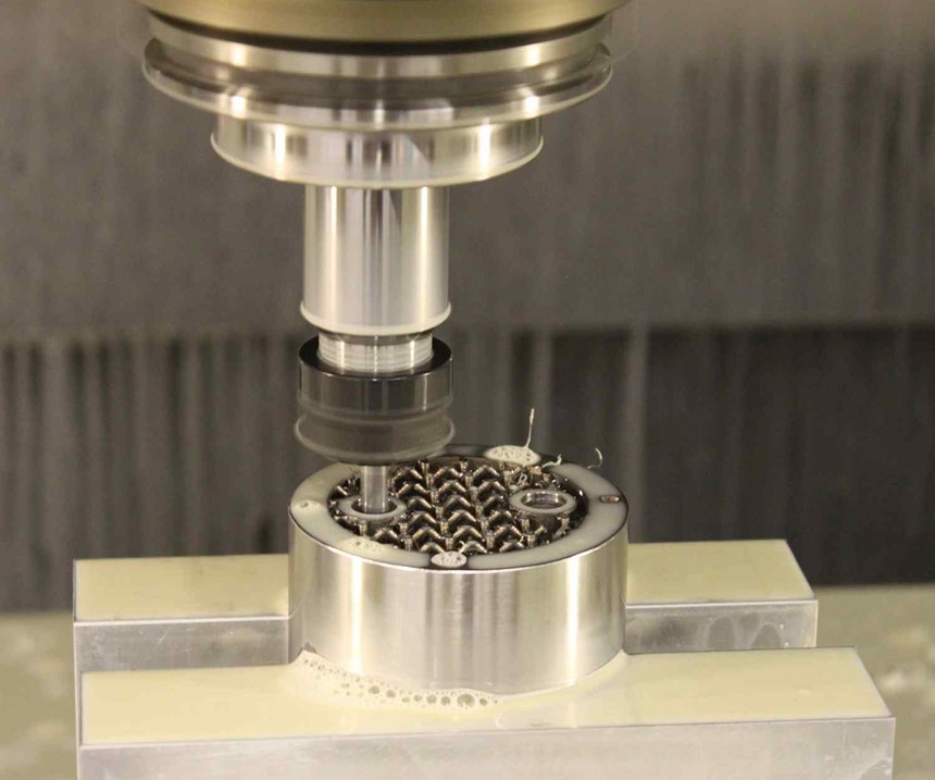 metal additive manufacturing part being machined to meet tolerances