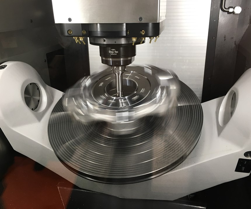 GF Machining Solutions' Mikron Mill P 800 U ST locks its spindle and angles its trunnion table for turning operations on a large, symmetrical component. 