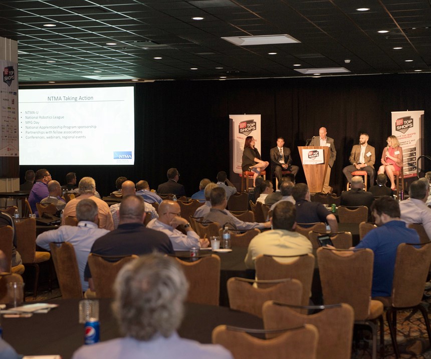 Attendees to the most recent top shops conference listen to a panel discussion about strategies empoeyd by leading shops. 