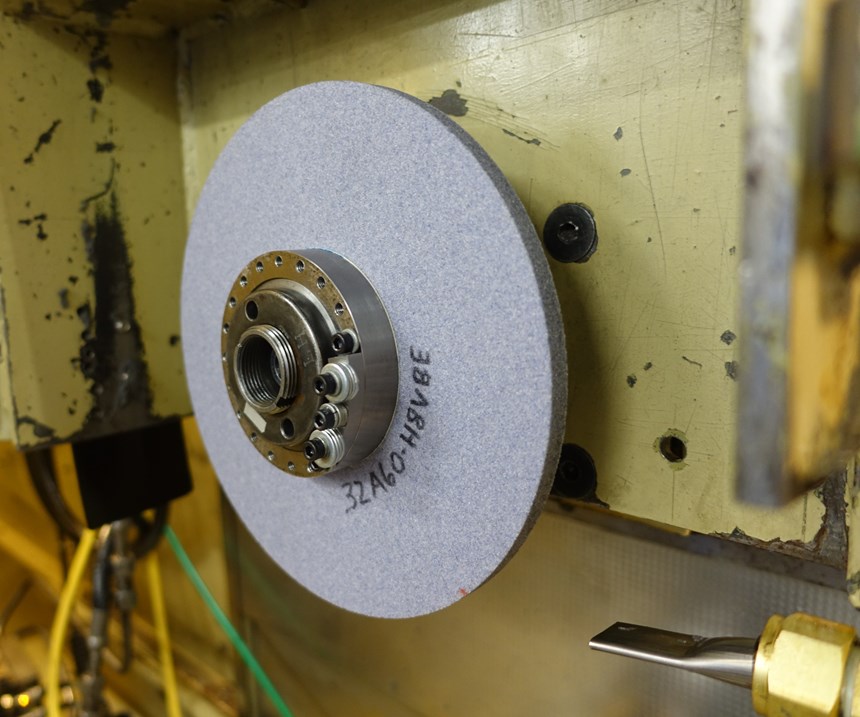 Imbalance added to grinding wheel for vibration research