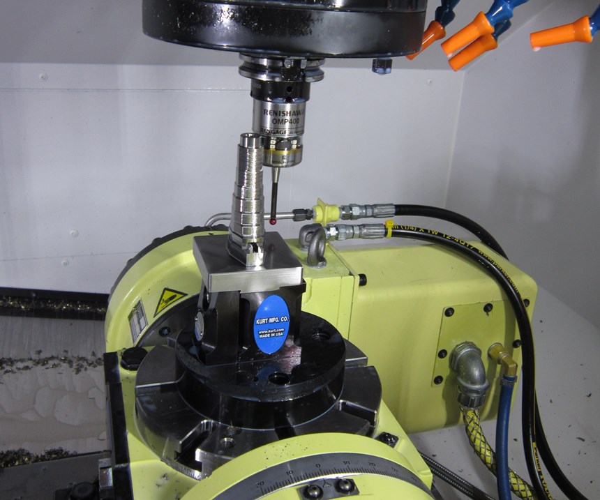 A touch-trigger probe from Renishaw probes a part on a rotary table