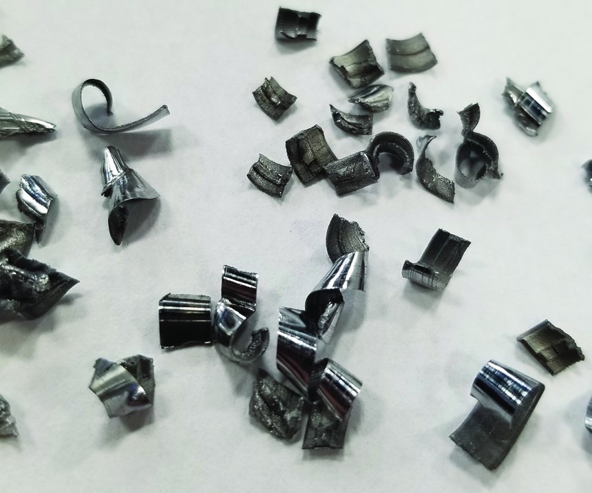A pile of short, curlicue-shaped chips generated by a properly performing, replaceable-tip drill in a deep-hole CNC machining application. 