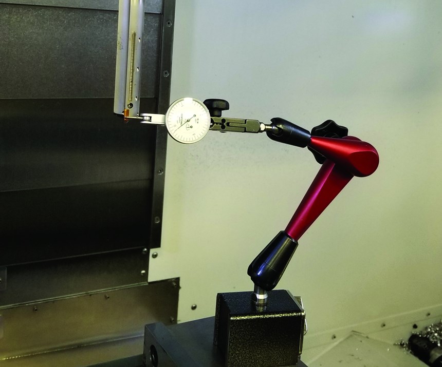 A complicated indicator setup illustrates the difficulty and time expenditure associated with measuring tools already mounted in the machine tool.