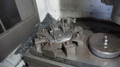 A grind ring casting fixture is all set up on an Okuma MB-46 CNC vertical machining center at Ace Stamping & Machine Co., a high-volume metal stamper in Racine, Wisconsin.