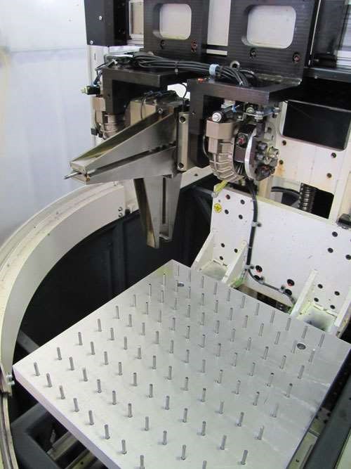 A palletized system for robotic loading of CNC tool grinders at True Cut Tool. 