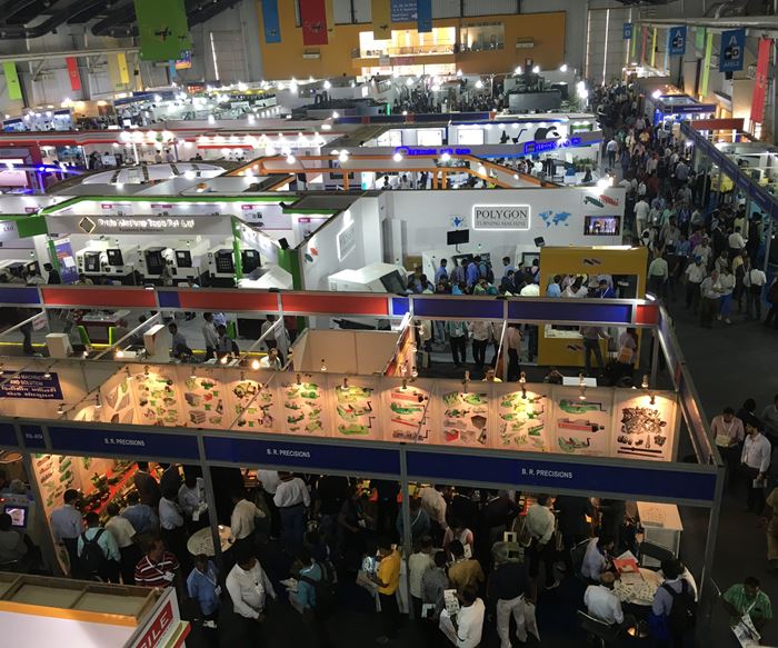 The halls of the IMTEX metal-cutting exhibition crowd with attendees. 