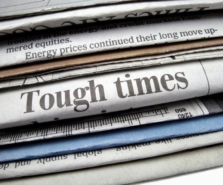 newspaper headline reads "Tough Times"