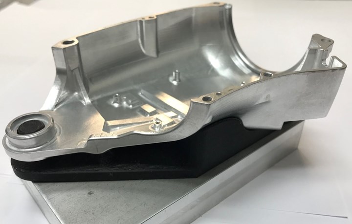 A CNC machined part is mounted on a 3D-printed fixture for CMM inspection at Advanced Precision Engineering (APE). 