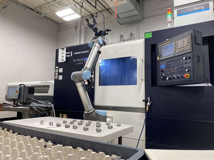 A UR10 collaborative robot from Universal Robotics loads and unloads a Hwacheon CNC machine at Advanced Precision Engineering (APE). 