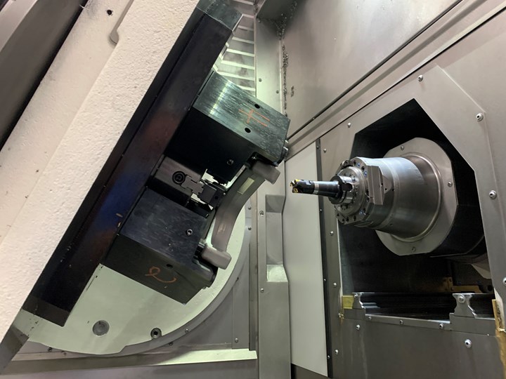 An inside view of a Grob G550 five-axis machining center reveals a tilting table and retractable spindle.