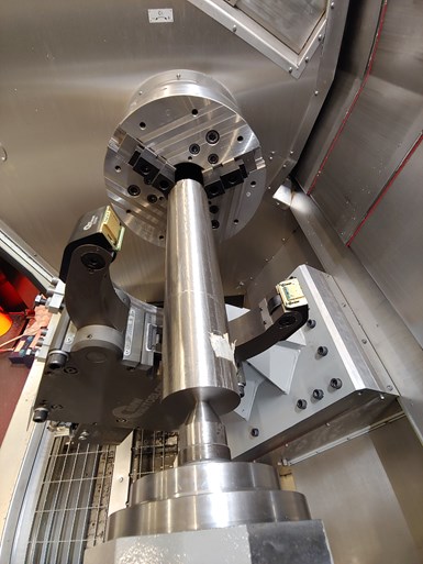A titanium tube set up on a machine tool for turning with a binderless CBN inserted cutting tool. 