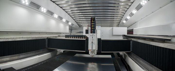 A wide shot depicts the gantry of an Eagle Inspire laser cutting machine. 