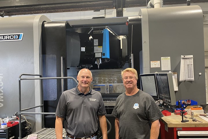 Steve Tury and Tony Wilson, co-owners of ACR Machine Co. in Coatesville, PA, stand in front of one of their newer CNC machine tools. 