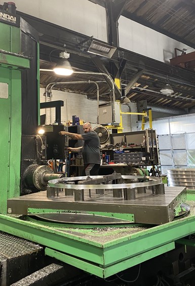 A CNC boring mill operator keeps a close eye on the cutting action as the machine cuts into a large steel ring at ACR Machine Co. in Coatesville, PA.