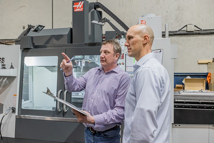 General Manager Helmut Hartman and Director of Finance Terrance Visser discuss production on Duo CNC’s shop floor.