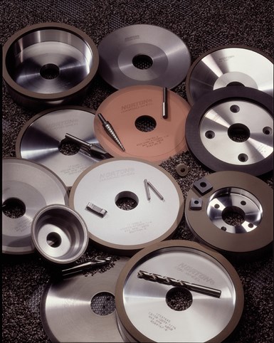 A photo of an assortment of Norton Saint-Gobain grinding wheels and tools.