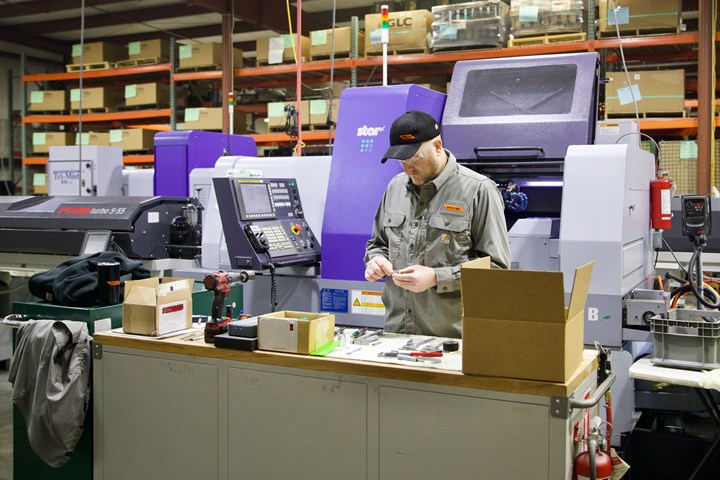 Mike Jones working next to a Star Swiss-type machine