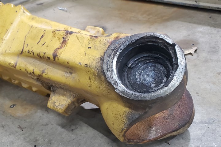 A bore for a constrution vehicle steering assembly shows signs of wear