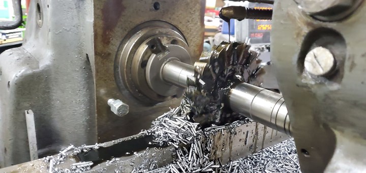A slotting cutter is buried deep in metal on a manual HMC. 