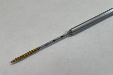 A needle-like surgical tool is an example of Metal Craft’s CNC machining work. 