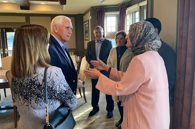 Aneesa Muthana speaking with former Vice President Mike Pence.