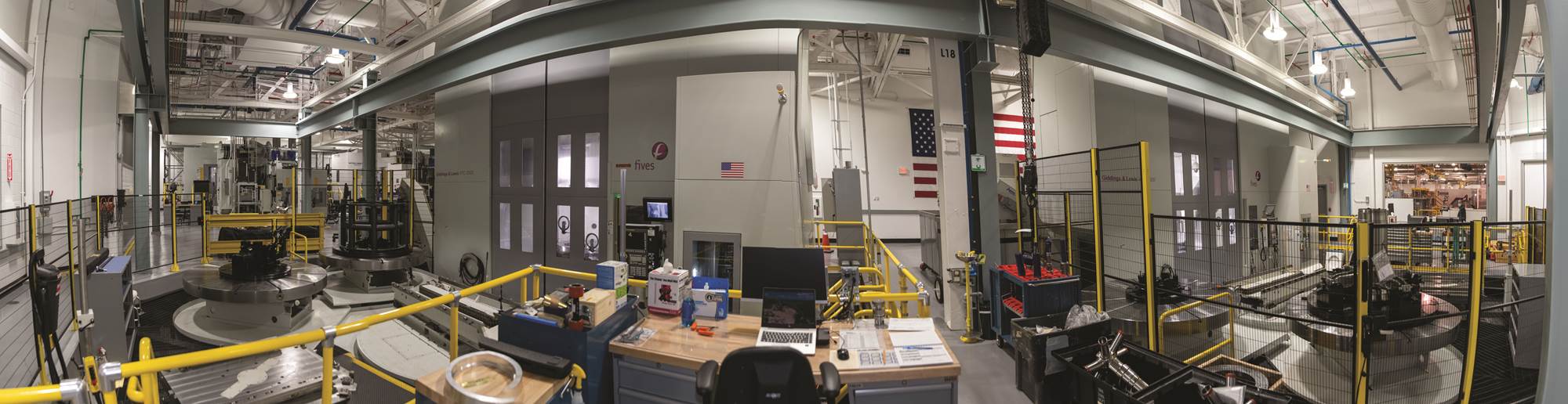 This panoramic view of the machining cell shows the VTLs in the foreground and the HMCs to the left. 