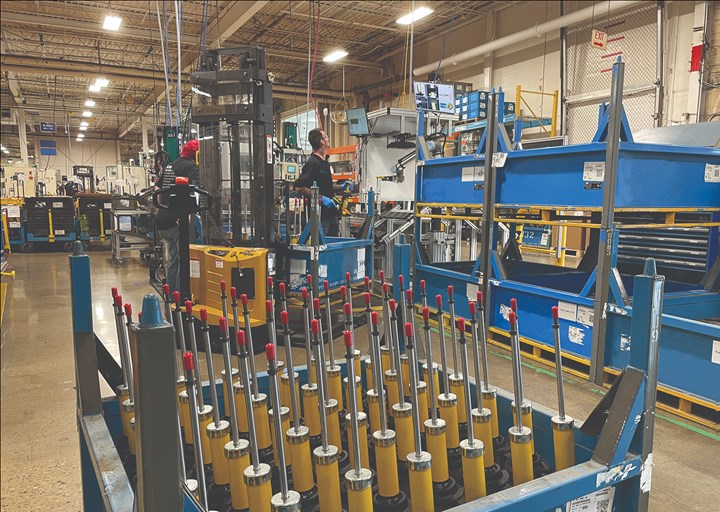shock absorbers in production at bilstein with cobot in background
