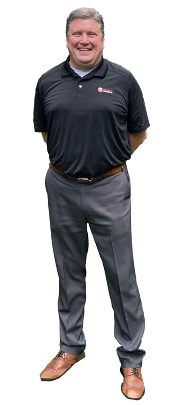 a photo of Doug Schulte, senior product manager at select machining technologies, wearing a black golf shirt and gray slacks