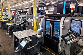 ProCobots robotic arm in a manufacturing line in a machine shop