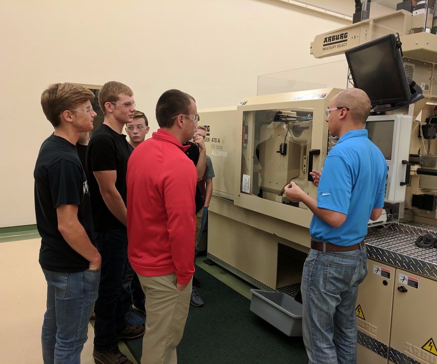 Students learn about molding quality parts at Plastikos on MFG Day 2017.