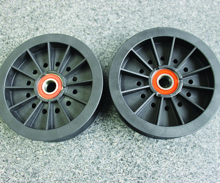 Two pulleys molded by Osco's six-drop hot runner system and three-drop hot runner system, respectively