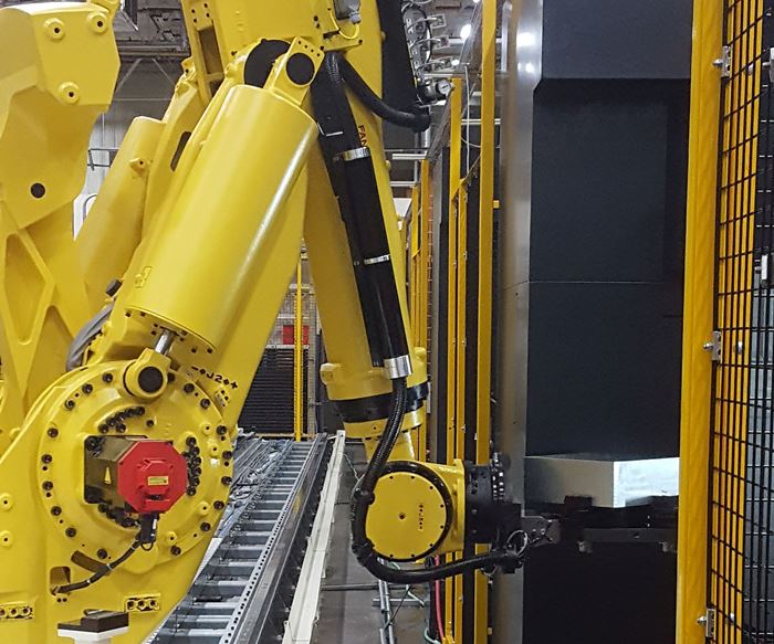 FANUC robot feeding a CNC machine at Cooper Tires