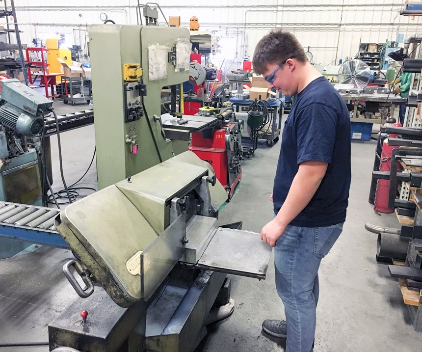 Sean Willard cuts stock for a new project on a bandsaw