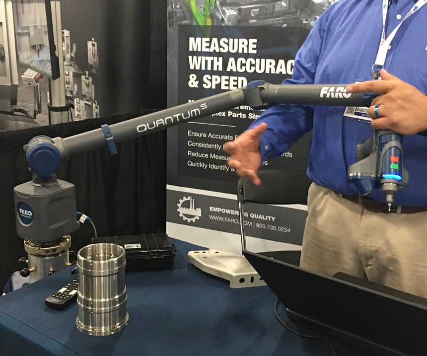 Booth exhibitor showing the Faro Quantum S 3D Scan Arm