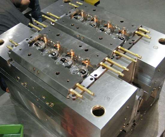 Integrated cap mold built by B A Die Mold Inc.