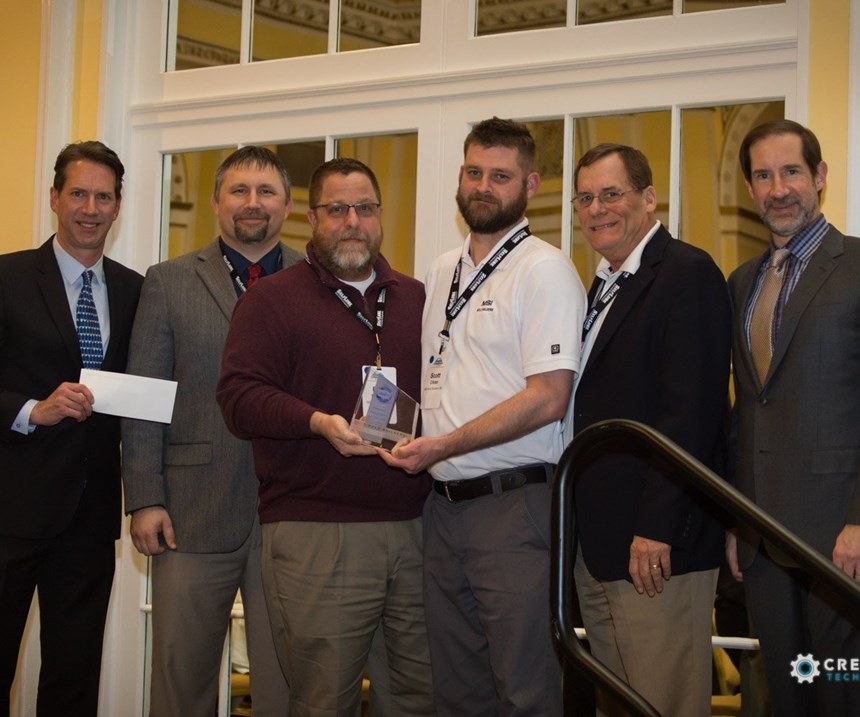 MSI Mold Builders receives Tooling Trailblazer award and scholarship check at AMBA conference.