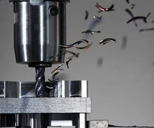 Machine tool drilling into metal