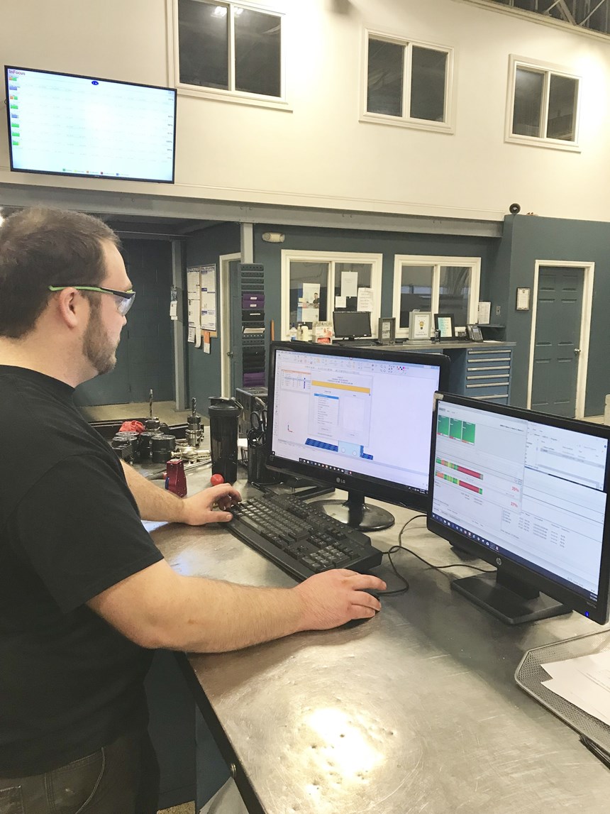 A TK Mold employee uses RER Software to monitor machine activity