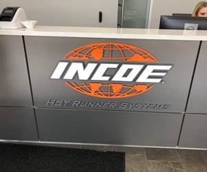 Incoe Corp. logo on counter in entry to new global headquarters