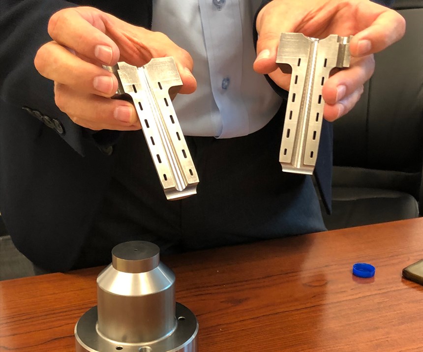 DME President Peter R. Smith holding new Conformal Cooled Cold Sprue Bushing