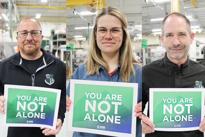 Westminster Tool employees hold up the NAMI 2021 slogan: “You are not alone.”