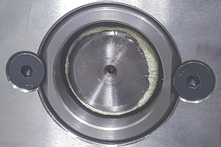 Bushing retained with screws.